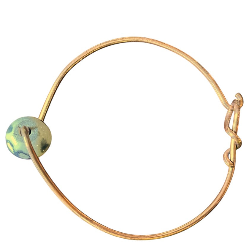 Upcycled and repurposed copper wire bracelet with ceramic bead