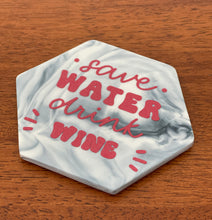 Load image into Gallery viewer, Upcycled ceramic hexagon drinks coaster with SAVE WATER DRINK WINE decal design
