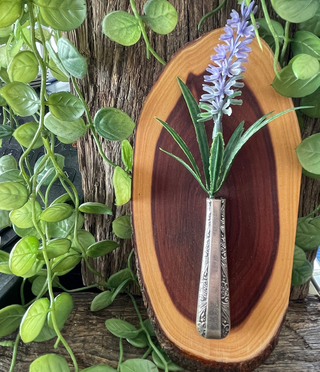 Gorgeous silver plated ornate bud vase mounted on polished mulga wood